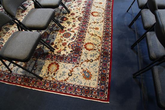 A Kashan ivory ground carpet, 14ft 3in by 10ft 7in.